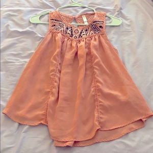 Light pink sleeveless blouse